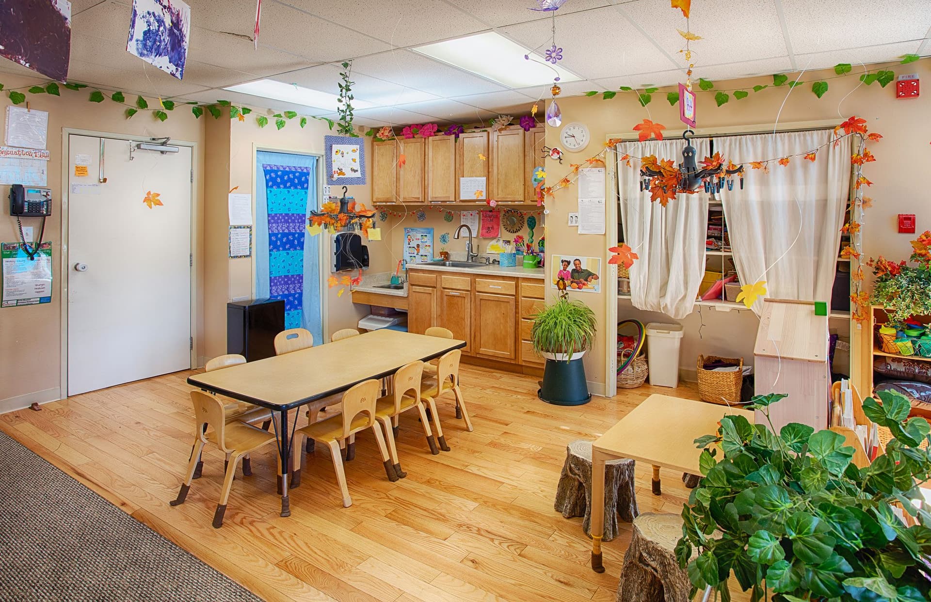 A teacher with preschoolers at Blue Skies Exploration Academy